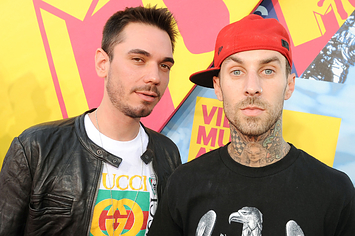 Travis stands next to DJ AM before the crash