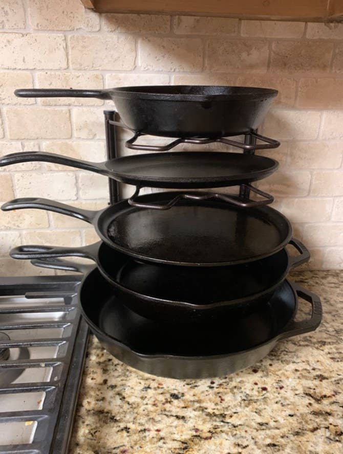 A reviewer&#x27;s pans stacked up on the rack 