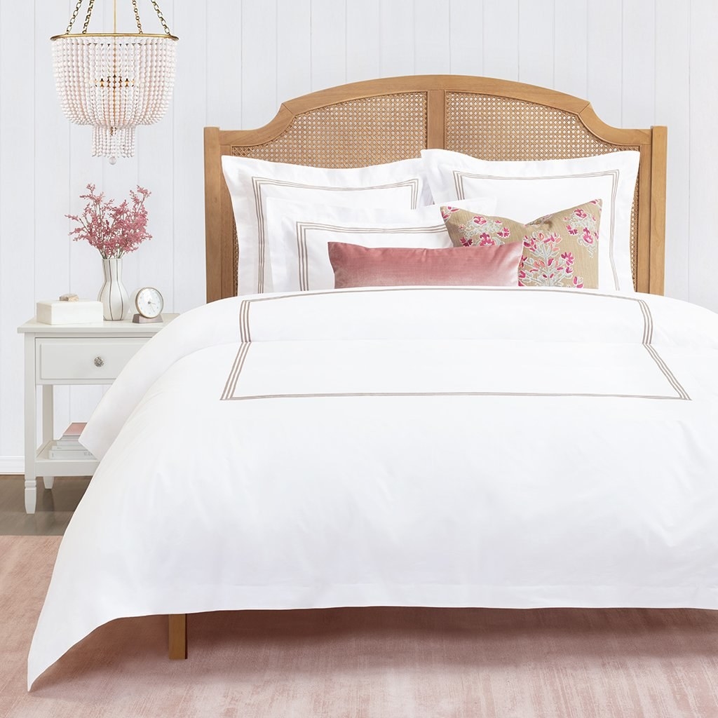 a white percale duvet cover with taupe stitching