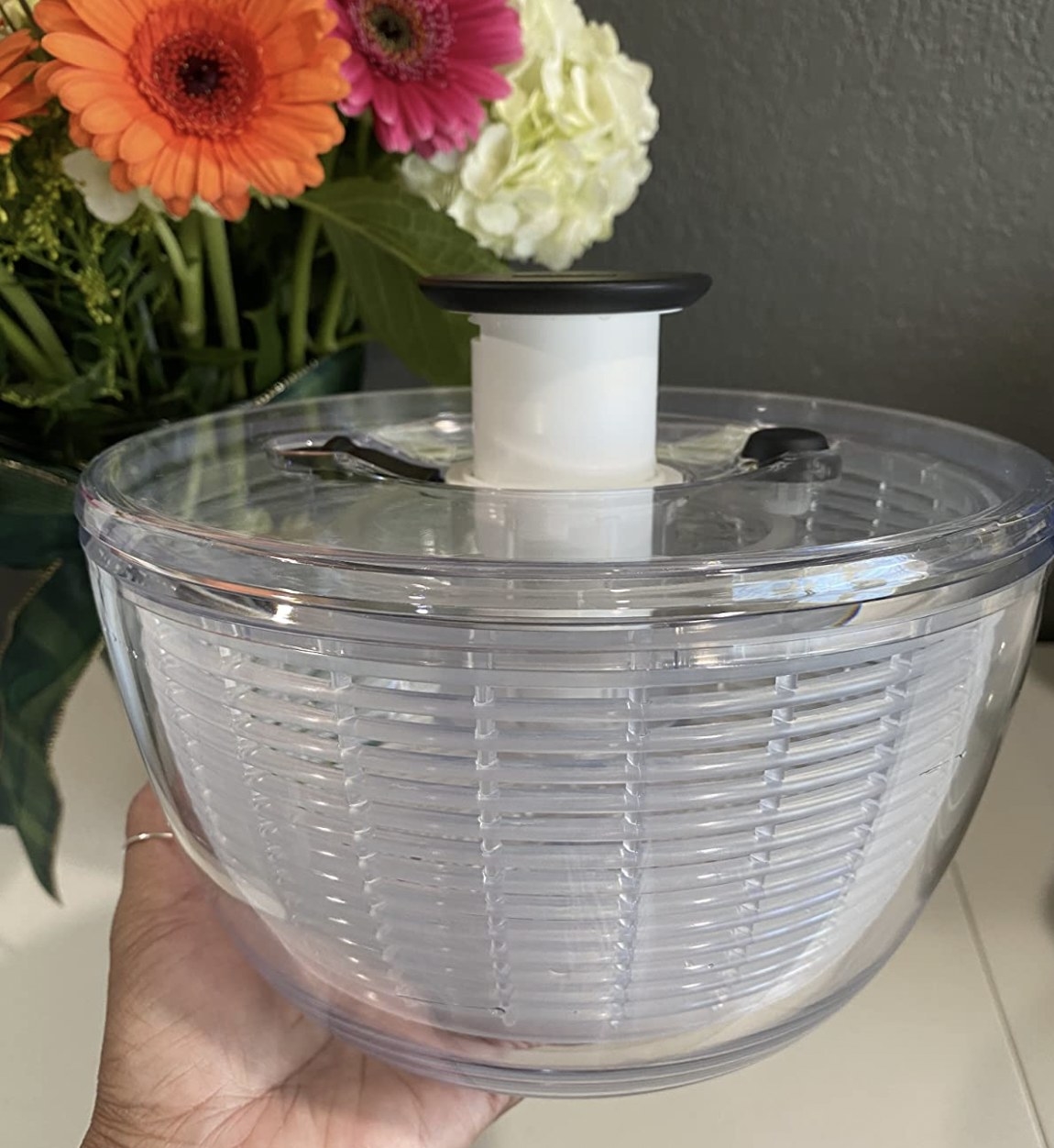a clear salad spinner in a reviewer&#x27;s kitchen
