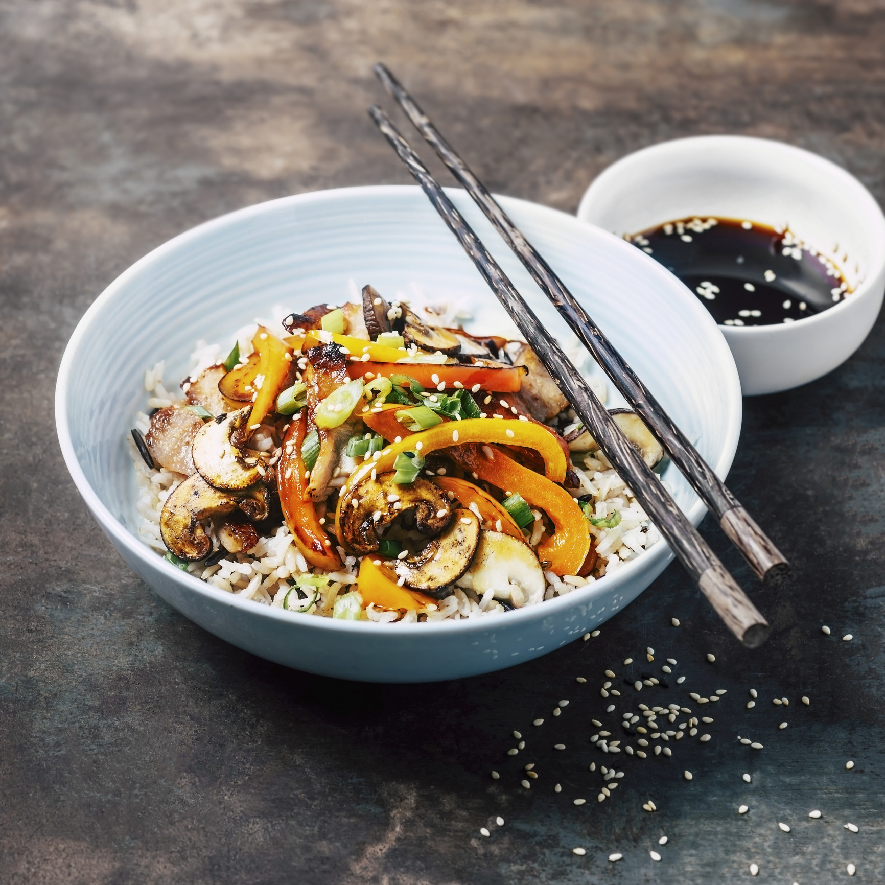Vegetable stir-fry over rice with soy sauce