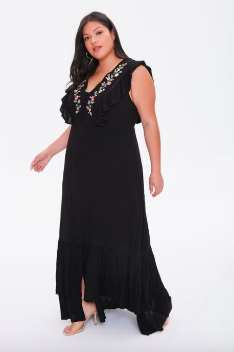 A model wearing the embroidered maxi dress