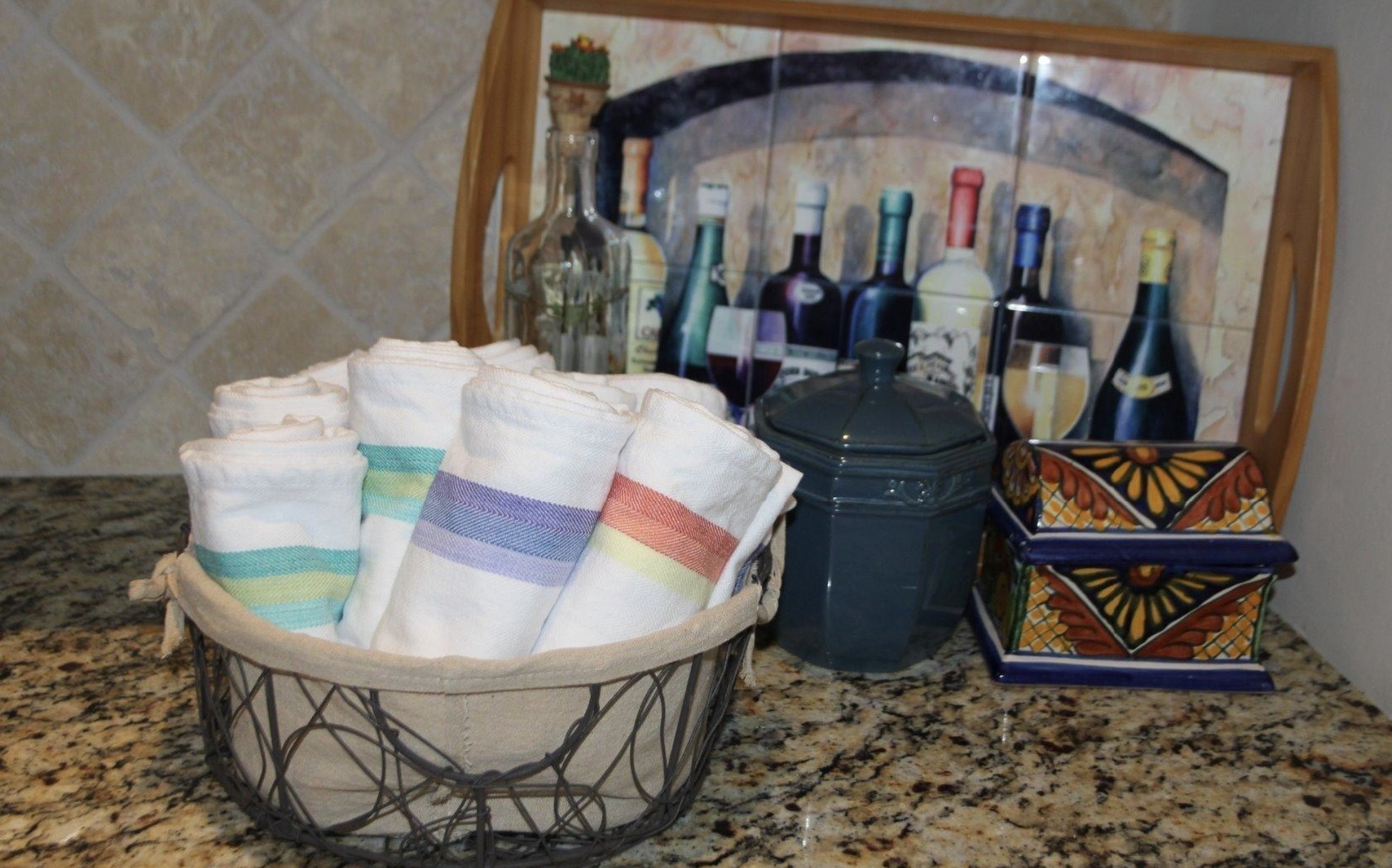 the hand towels in a basket on a kitchen counter