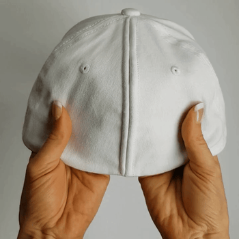 a model showing how the back of the hat has magnets that allows it to open and close