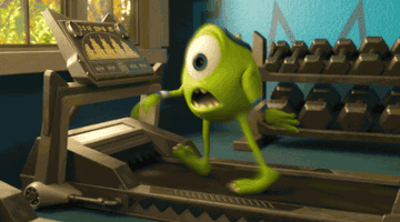 a gif of mike wazowski fumbling on a treadmill
