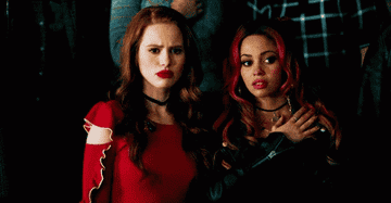 Toni and Cheryl looking confused and disgusted