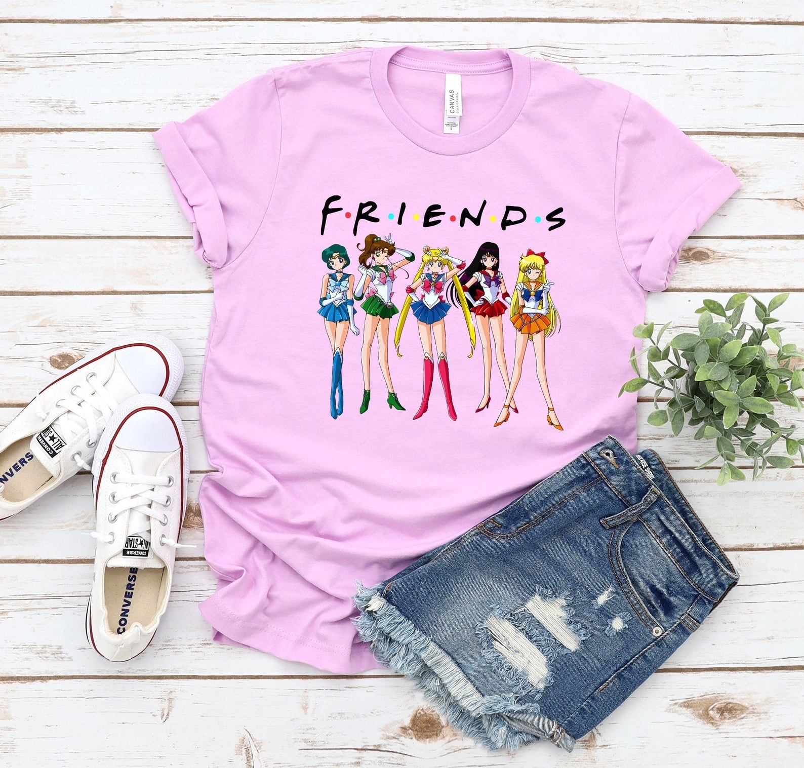 Pink T-shirt with &quot;Friends&quot; logo and &quot;Sailor Moon&quot; characters