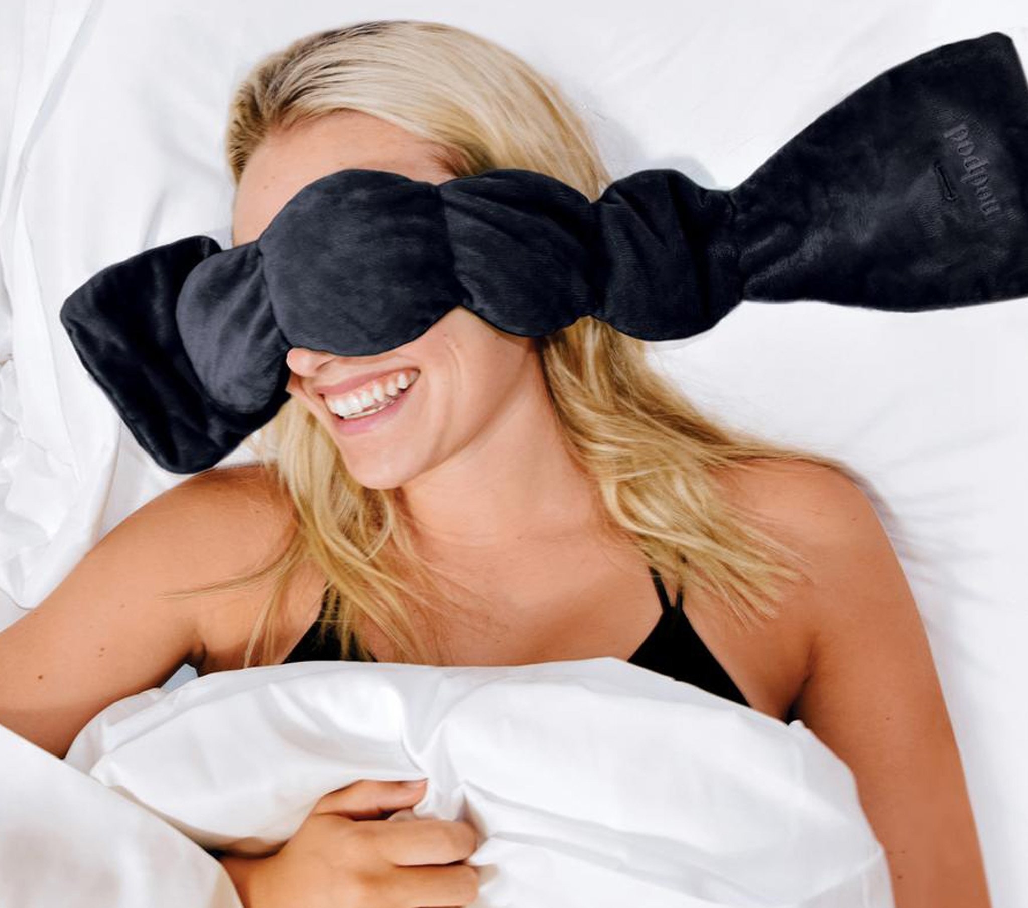 A model with the long eye mask draped over their face