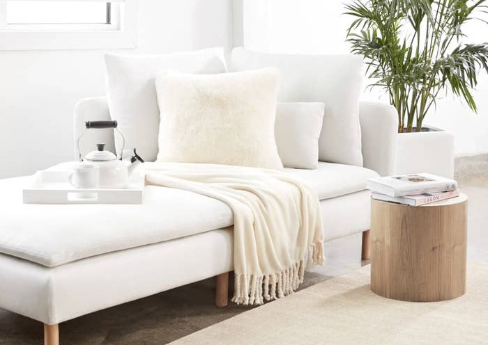 The plush blanket on a chaise lounge