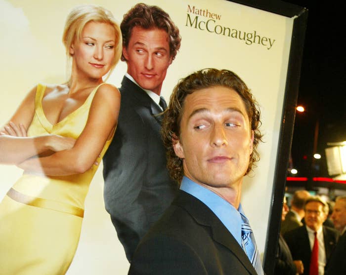 Matthew standing in front of a How to Lose a Guy in 10 Days movie poster