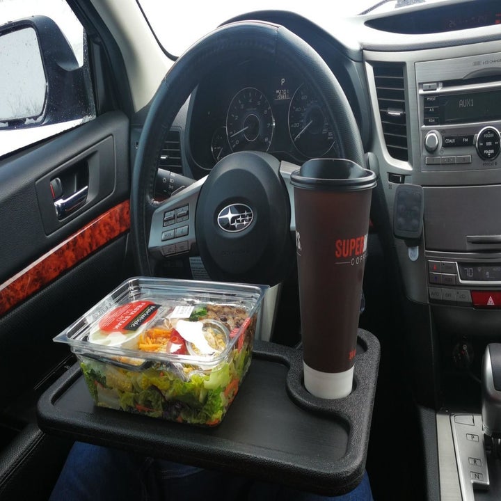 reviewer photo car tray set up in car with salad and coffee on it