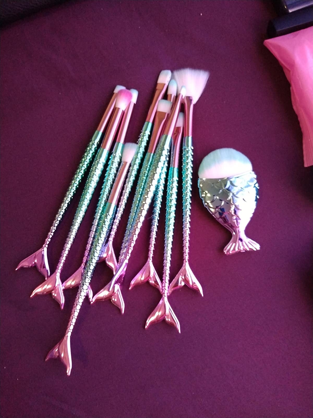 Reviewer&#x27;s set of mermaid-themed makeup brushes