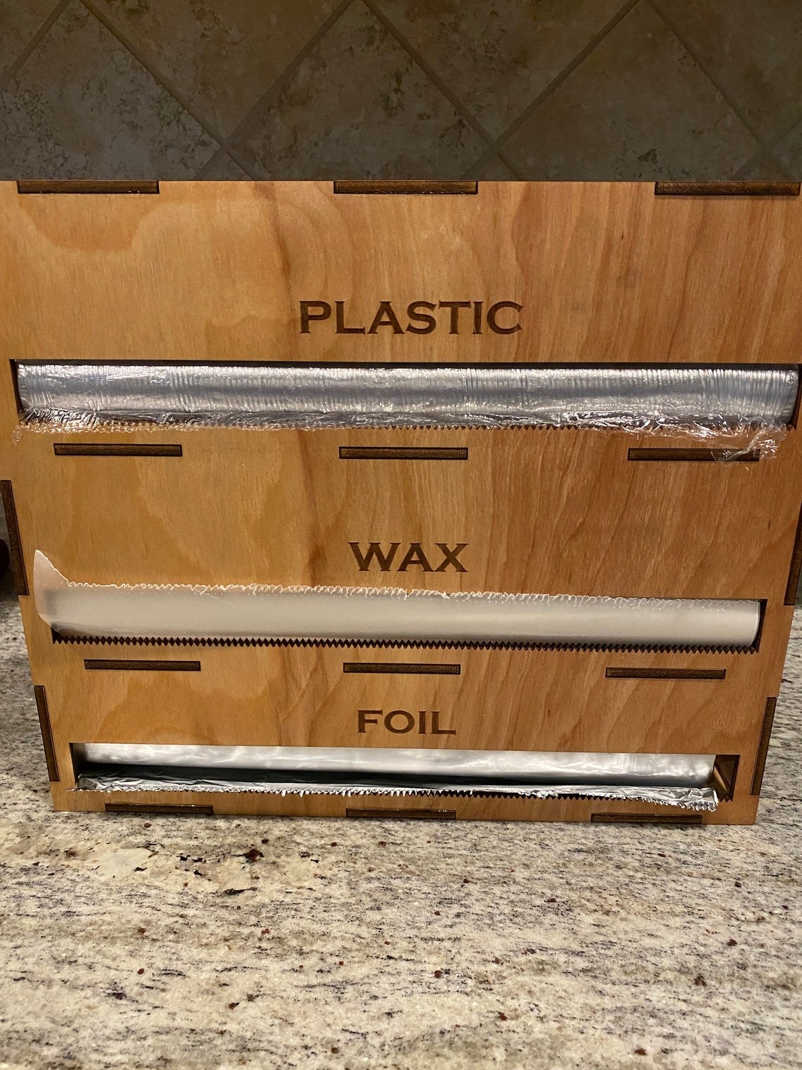 organizer with area for foil, wax, and plastic 