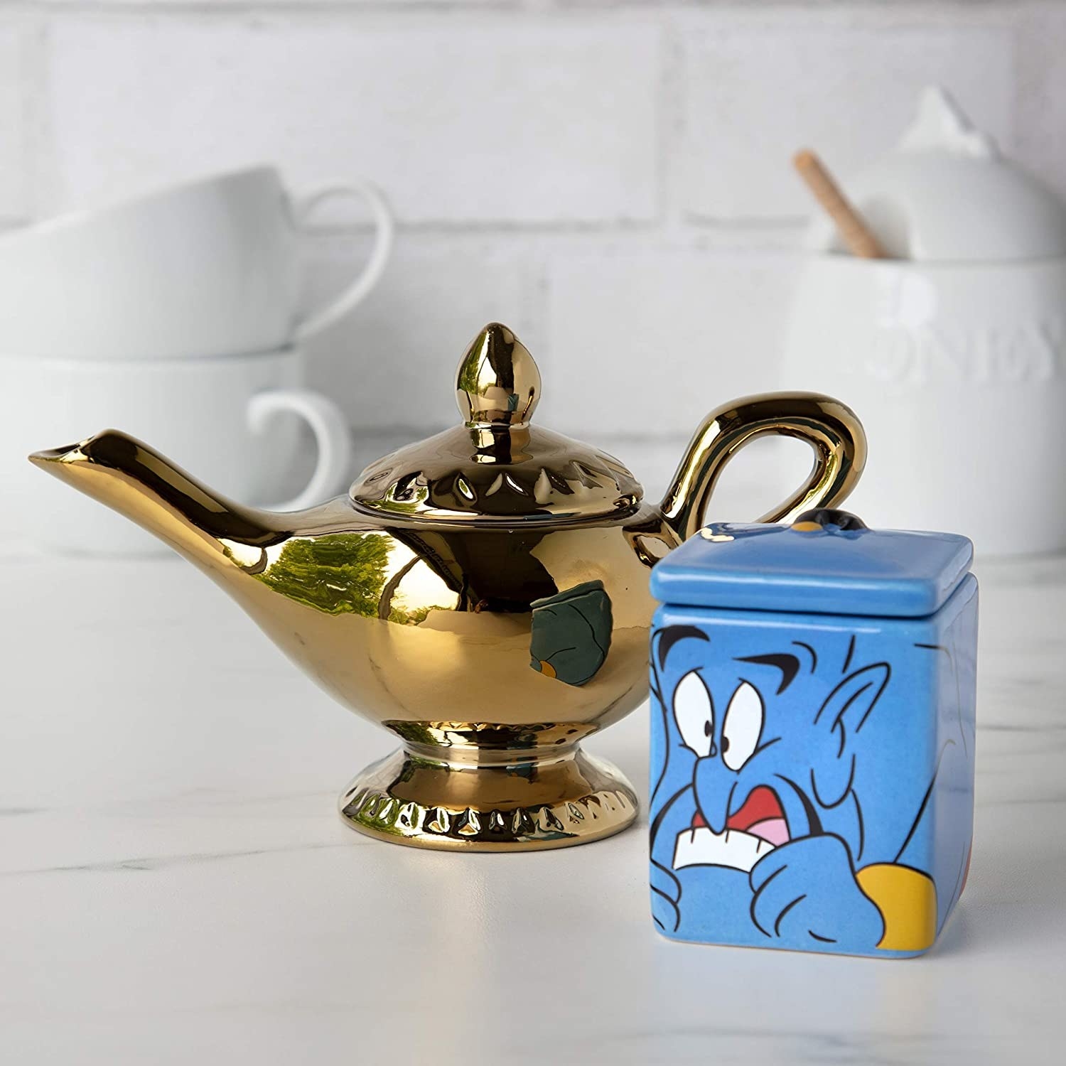 &quot;Aladdin&quot; themed lamp and genie sugar container placed on counter