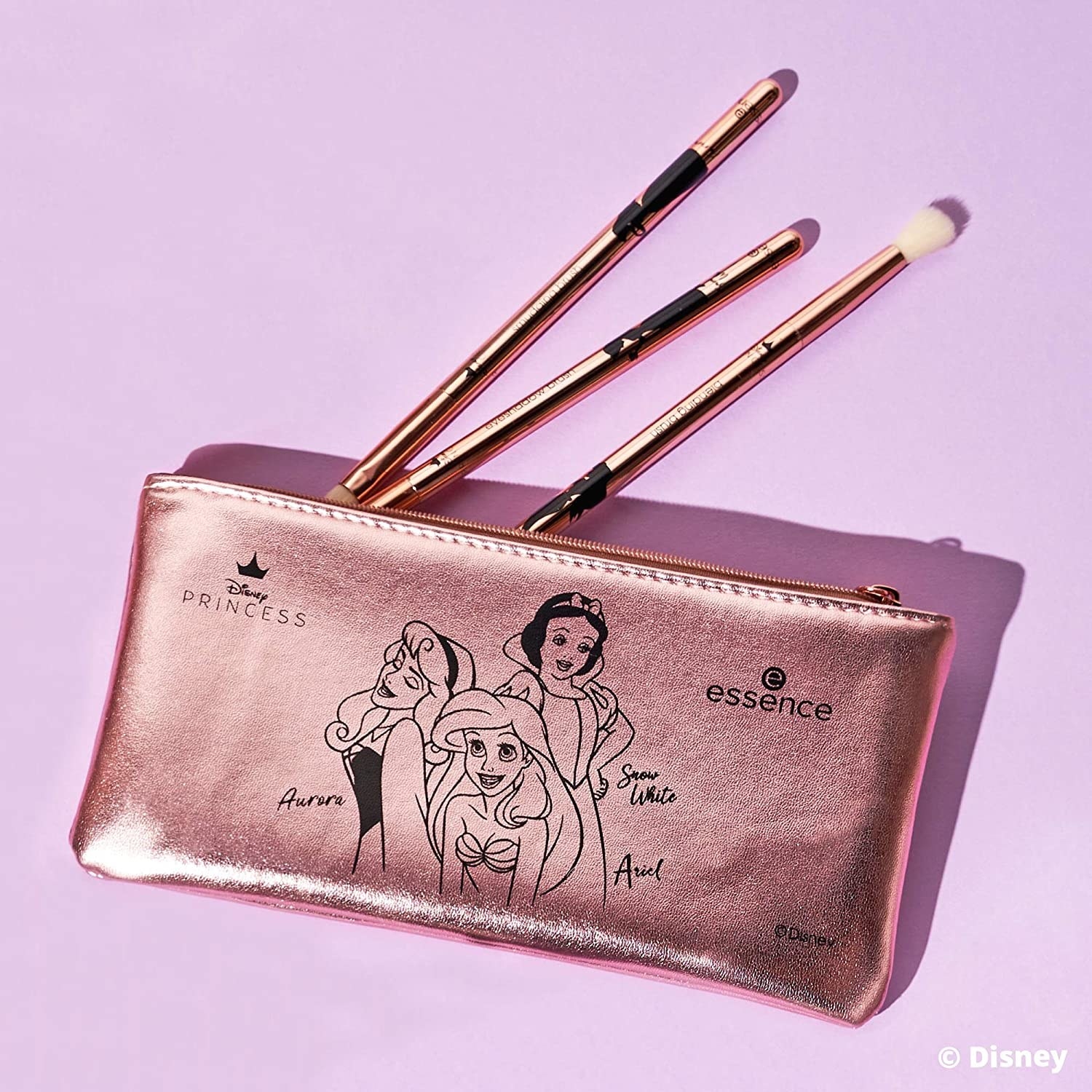 Disney Princess Essence makeup pouch with three brushes and graphics featuring Ariel, Snow White, and Aurora