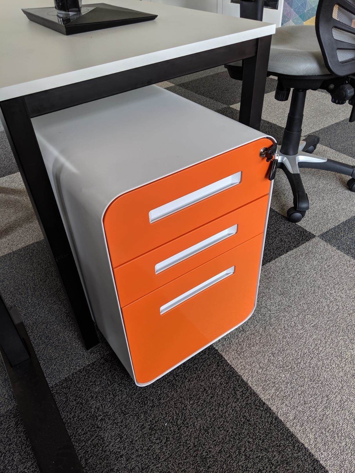 The filing cabinet in white and orange