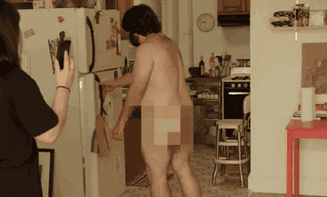 GIF from &quot;Broad City&quot; of Bevers opening the fridge nude