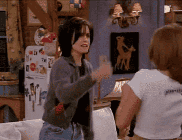 GIF of Monica and Rachel fighting on Friends