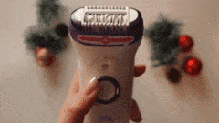 GIF of someone holding and turning on an epilator