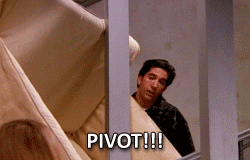 Man carrying couch down the stairs and shouting &quot;Pivot&quot;