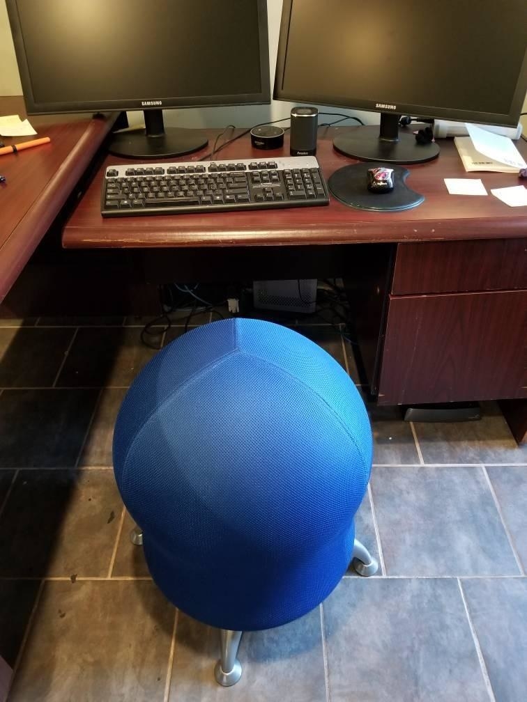 The blue chair next to a desk