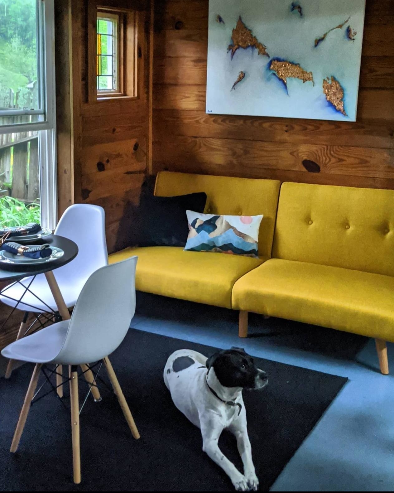 A reviewer photo of the couch in yellow