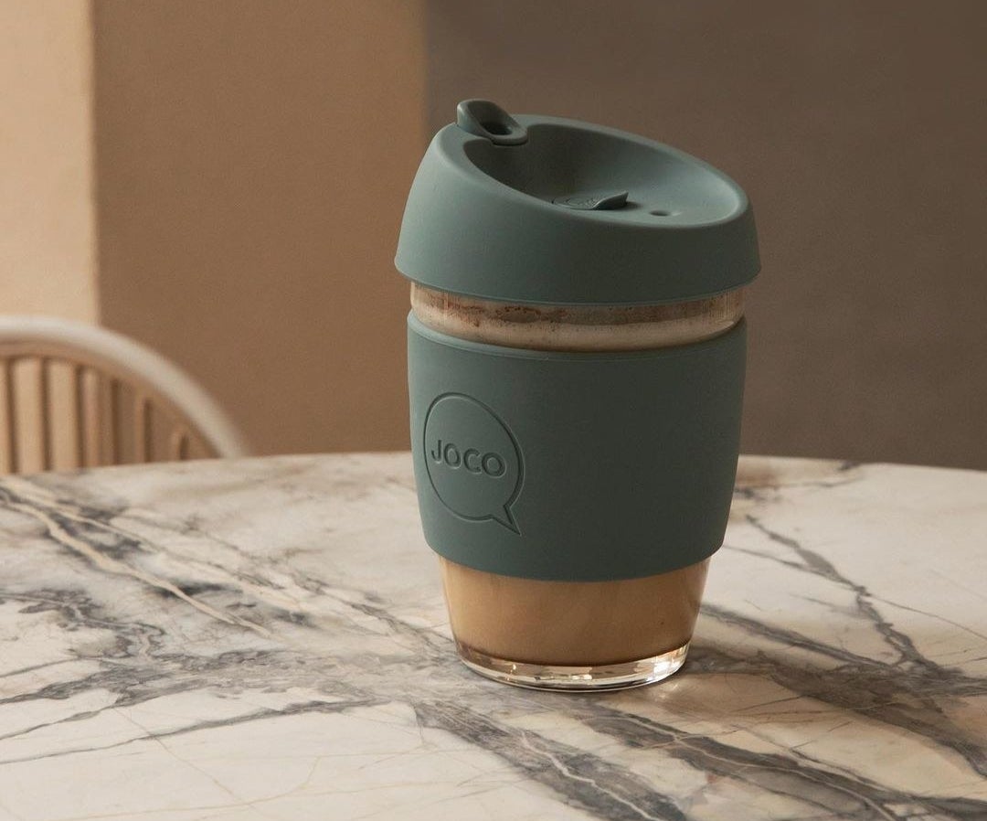A glass coffee mug on a small table