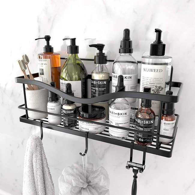 A stainless shower basket shelf with hooks