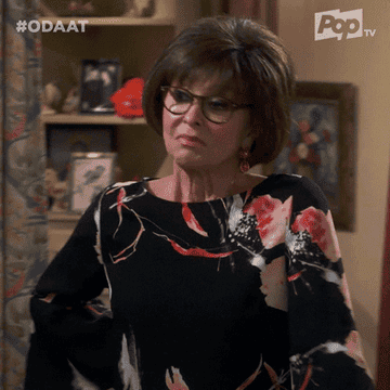 GIF of rita morena in &quot;one day at a time&quot; sassily saying &quot;i am&quot;