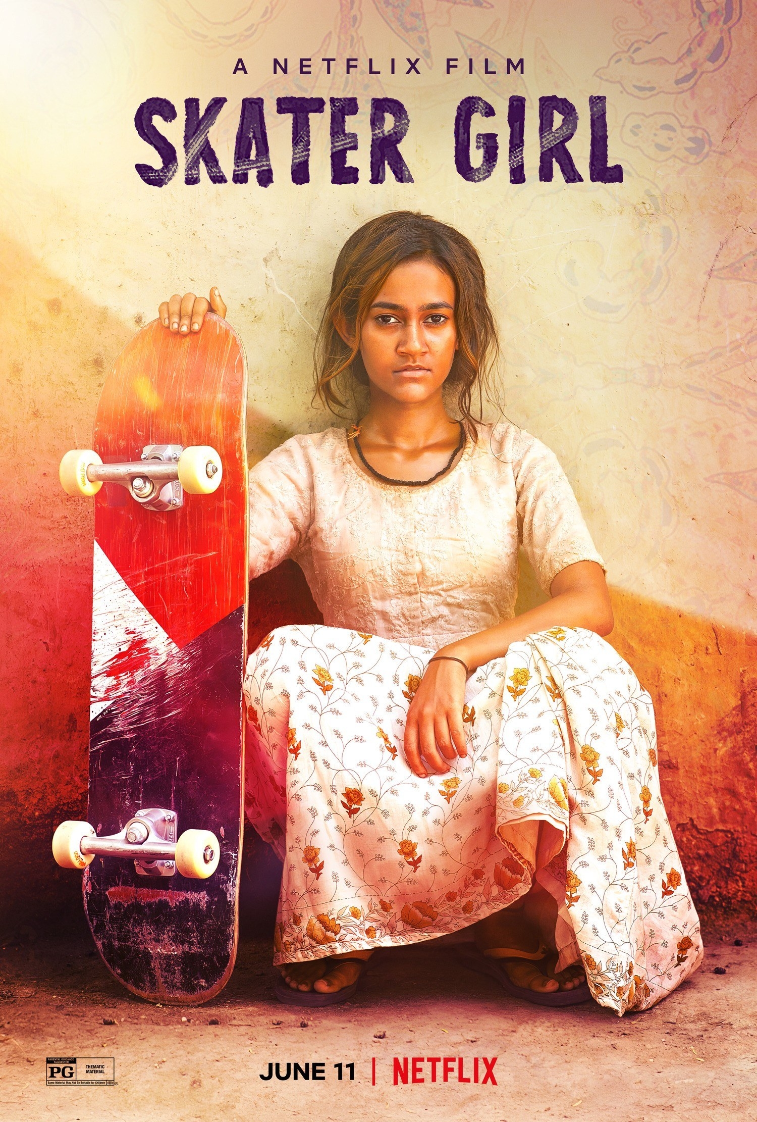 a girl sitting for a portrait while holding her skateboard