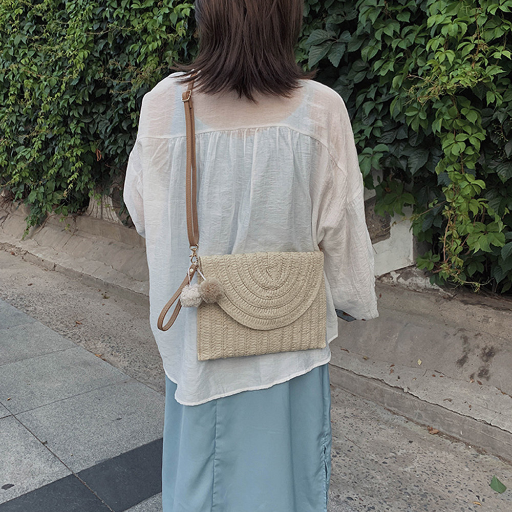 person wearing the purse from behind
