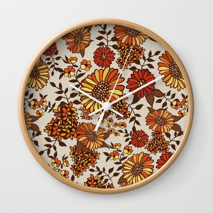 a clock with a floral background