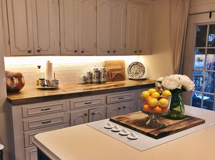 reviewer image of kitchen cabinets with lighting installed underneath 