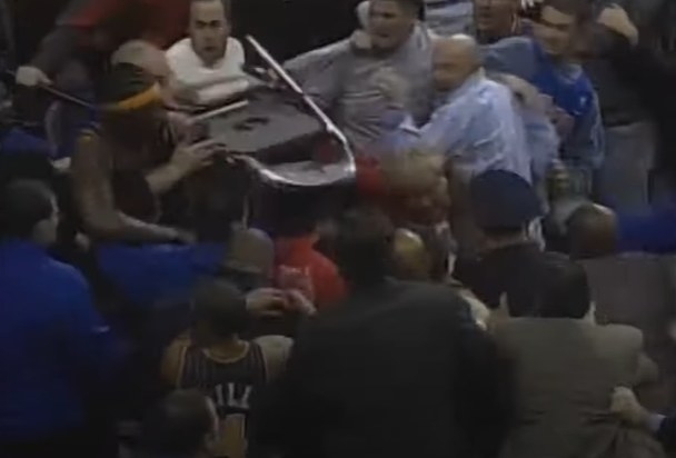 Crowd brawling with basketball players