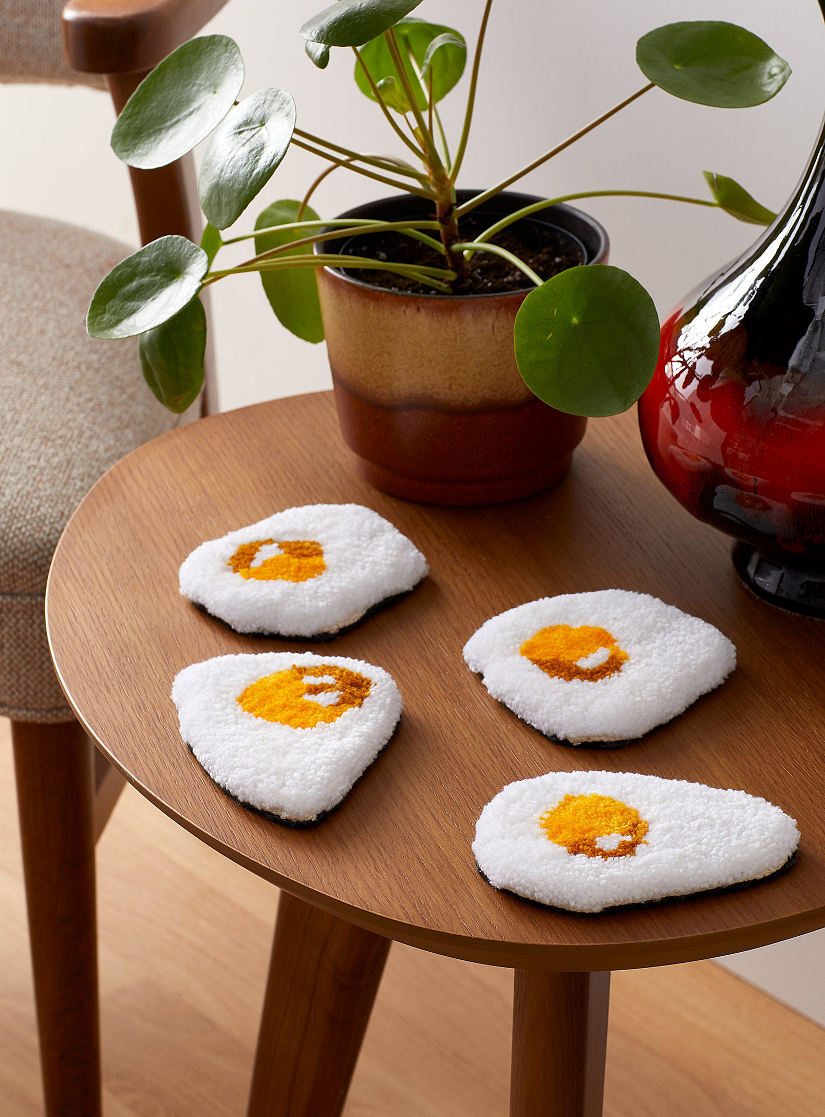A set of handmade sunny-side up egg coasters