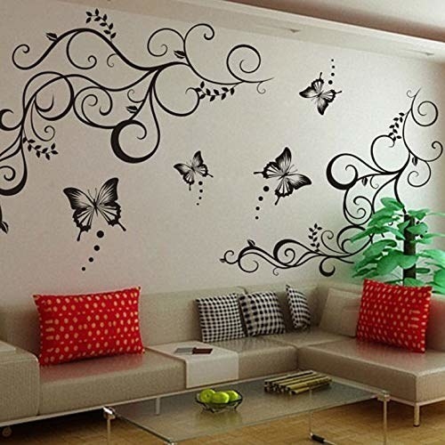 Decals decorating a wall above a sofa set.