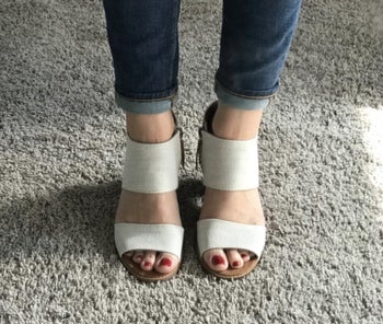 Same reviewer wearing the white cut out sandals