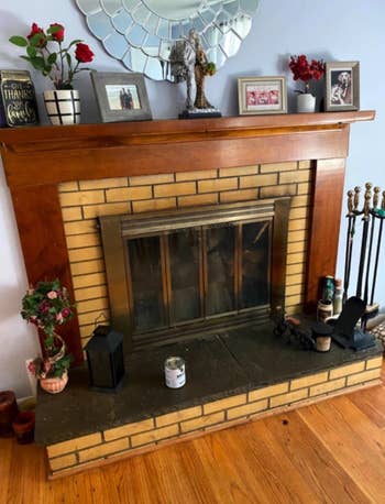 before image of reviewer's fireplace with yellow brick