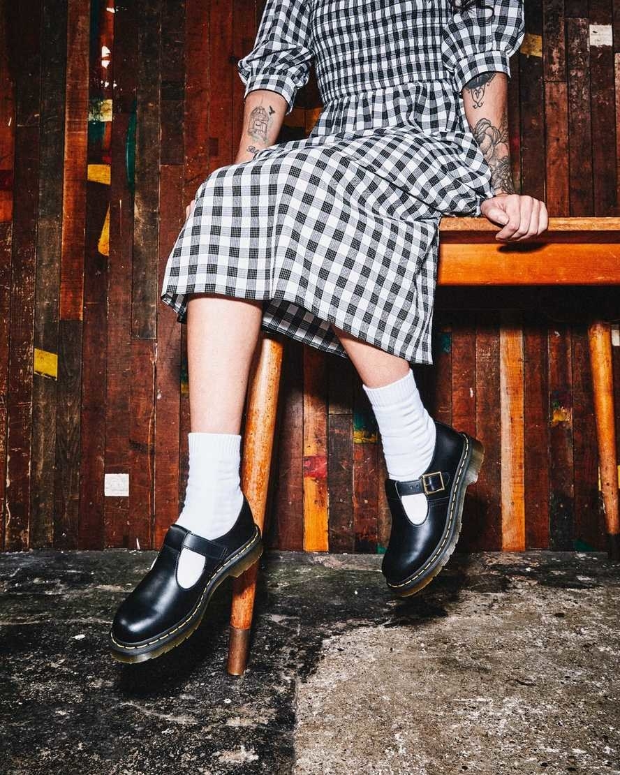 Model&#x27;s legs with the buckled shoes paired with long white socks