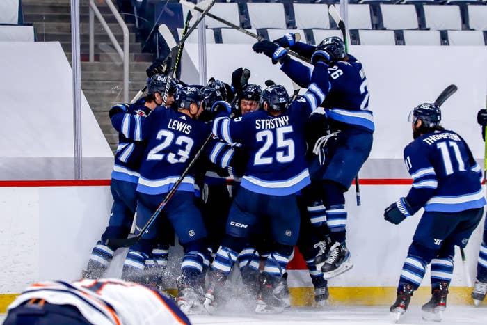 An image of the Winnipeg Jets celebrating their victory.