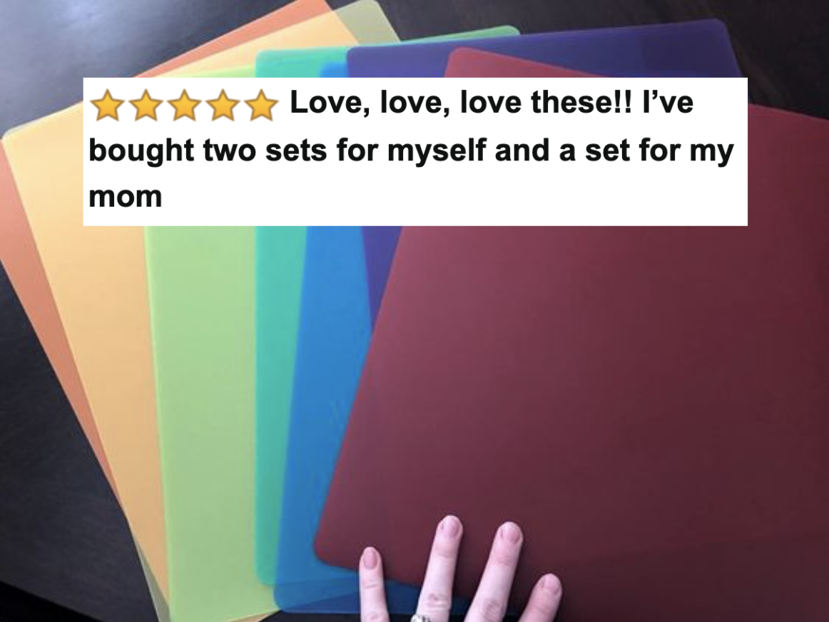 Reviewer&#x27;s picture of the rainbow cutting boards with five-star caption &quot;love, love, love these! I&#x27;ve bought two sets for myself and a set for my mom&quot;