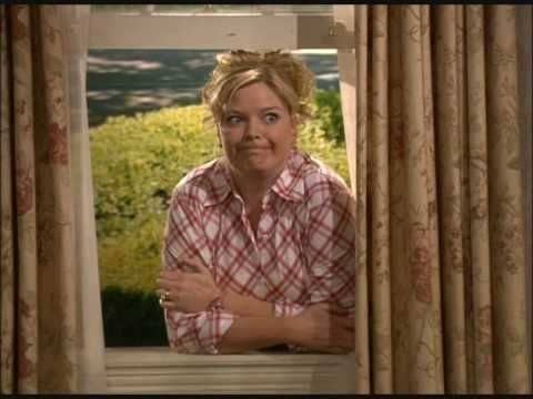 Barbra Jean talking to Reba through her window and making a silly face