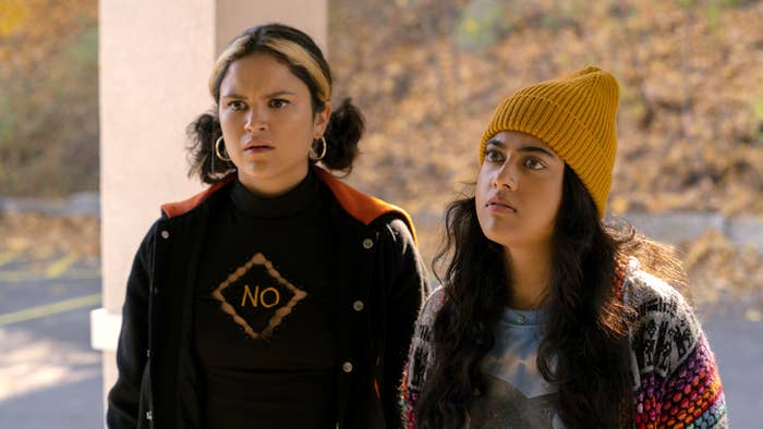 Lupe with a shirt that says "no" and her hair in pig tails, and Sunny wearing a yellow knit beanie over her long hair