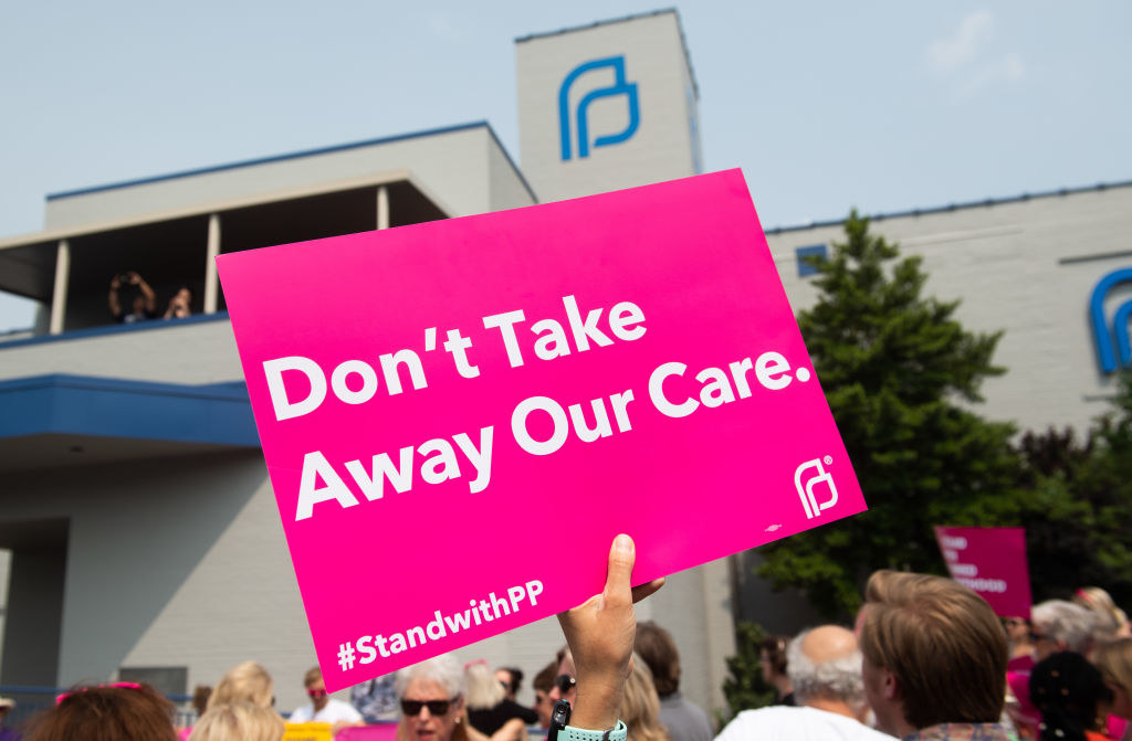 A don&#x27;t take away our care sign outside a planned parenthood