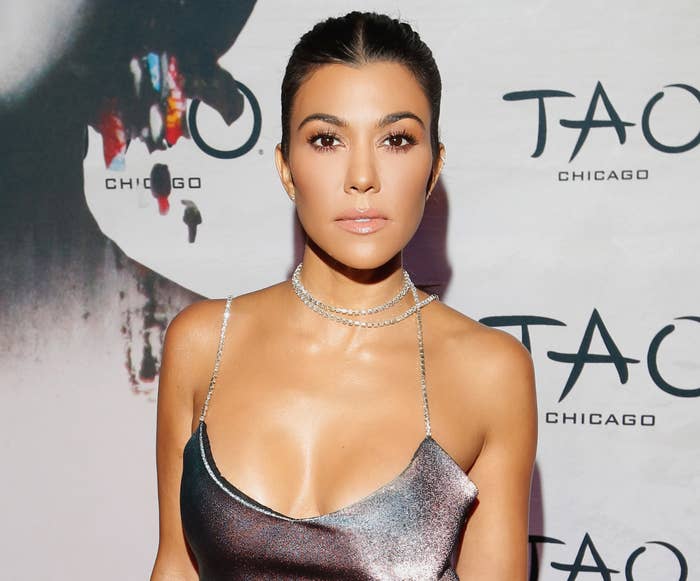 Kourtney wears a silver dress to an event