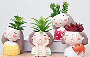 Mini planter pots that look like super adorable illustrations of girls.