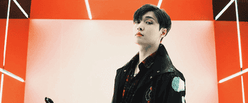 Lay poses in Exo&#x27;s music video for &quot;Tempo&quot;