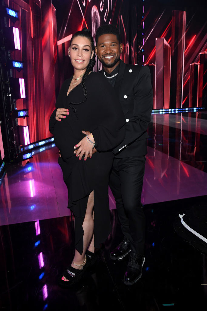 (L-R) Jennifer Goicoechea and Usher attend the 2021 iHeartRadio Music Awards in all black