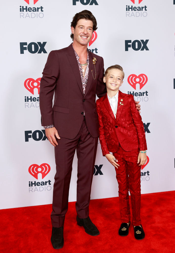 (L-R) Robin Thicke and Julian Fuego Thicke rock suits at the 2021 iHeartRadio Music Awards