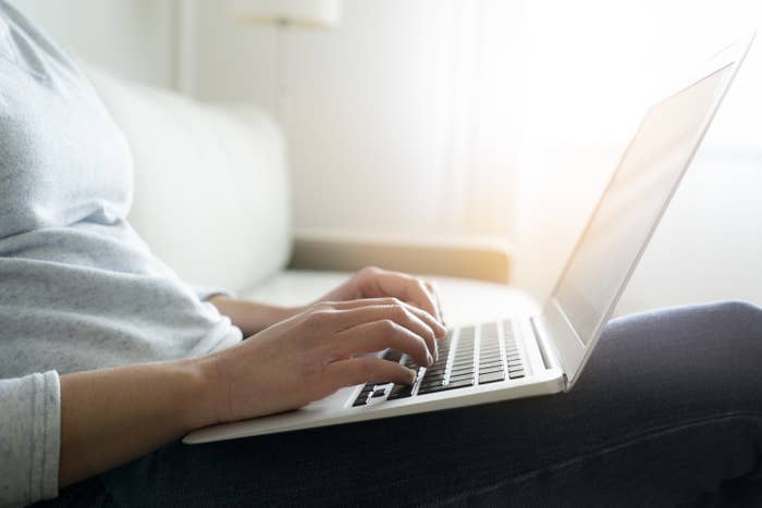 Person checking their loan balances on a laptop